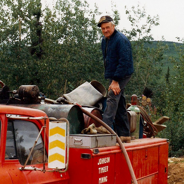 Heavy equipment at work in a historic mining landscape